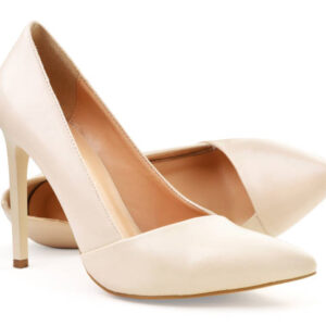Pair of women's beige shoes close up on a white background. isolated